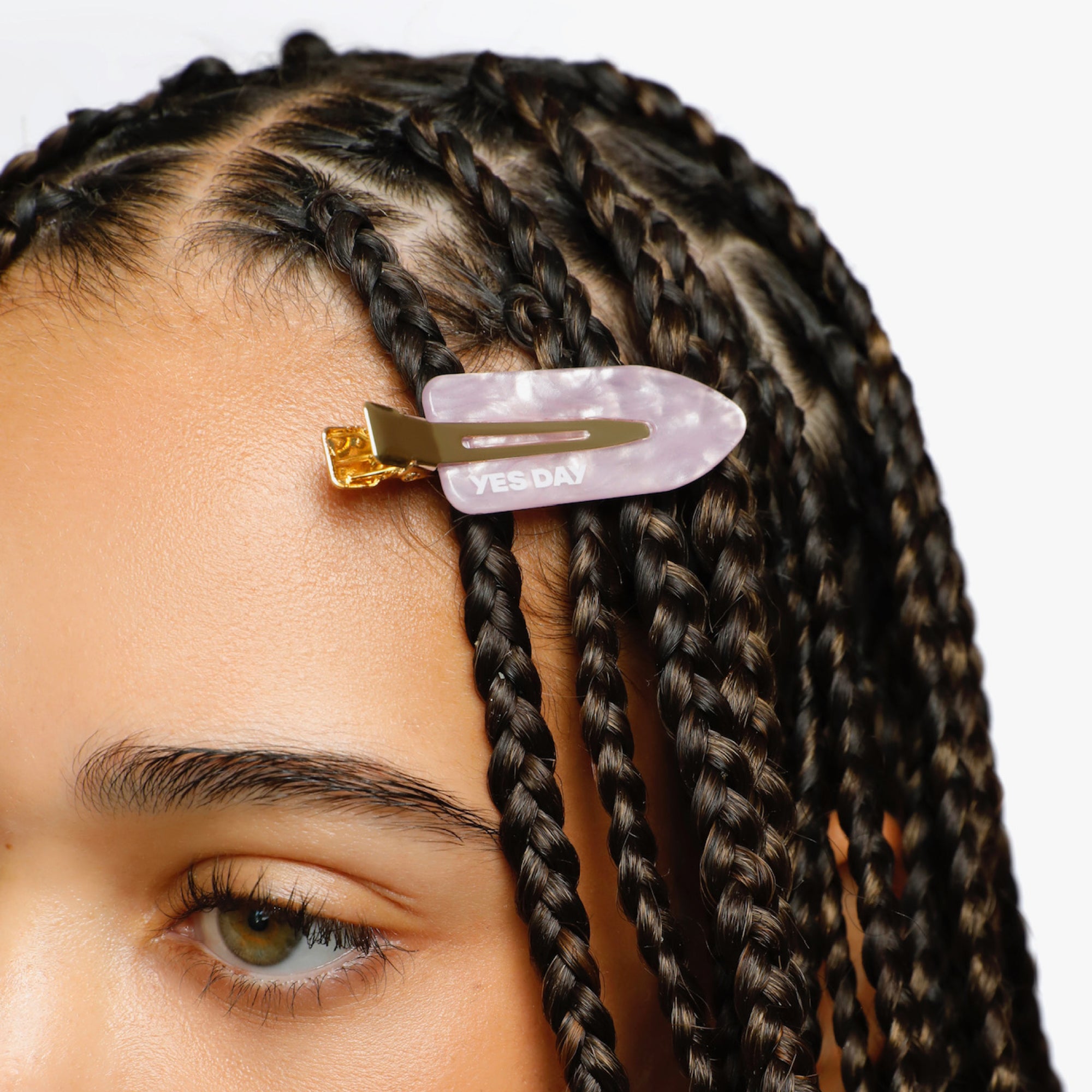 YES DAY Smoothie Hair Clip holding hair back near the hairline on YES DAY founder Coco.